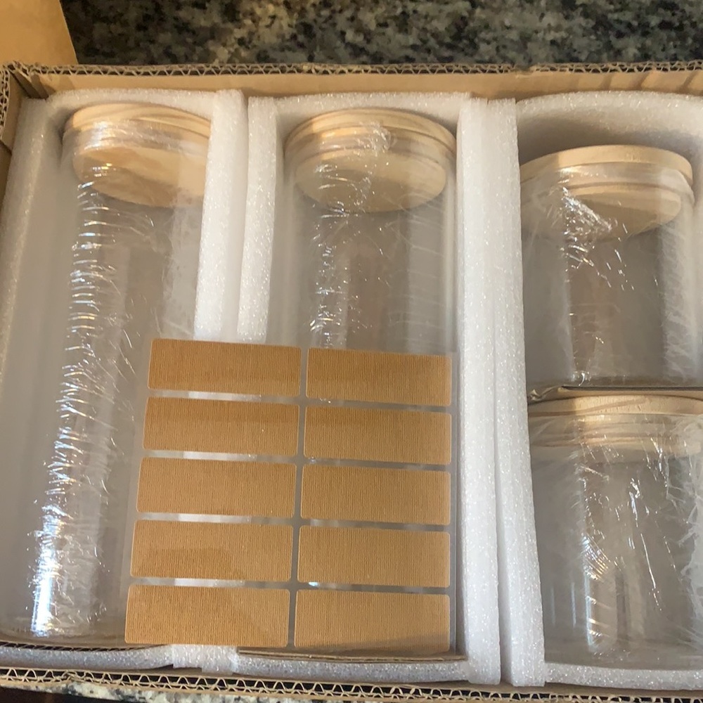 Glass food storage jars with labels